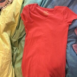 It is a pink shirt from Faded Glory, and it is a size small.